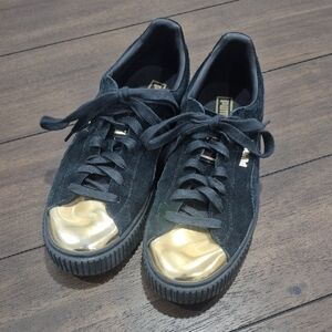 Puma Black Suede Sneakers with Gold Accents